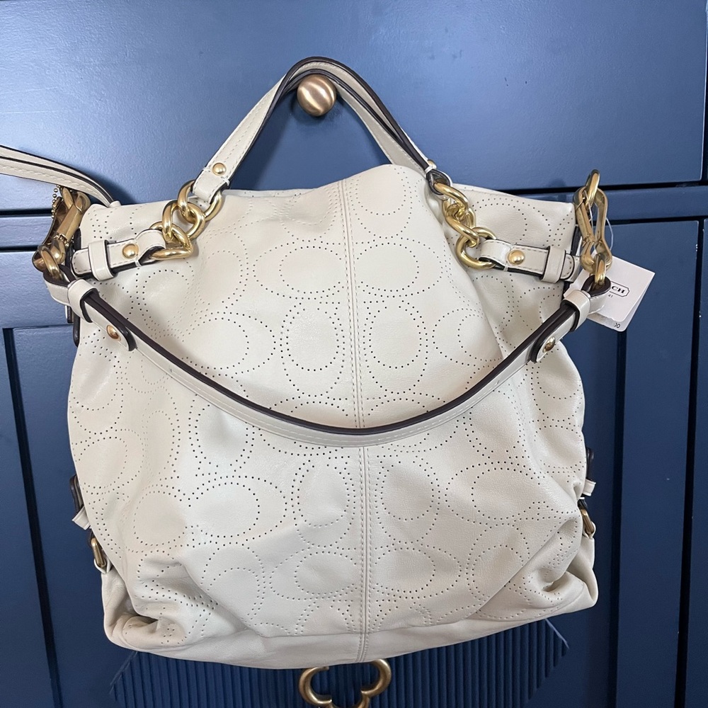 Brand New with Tags Coach perforated “C” leather bag in cream.